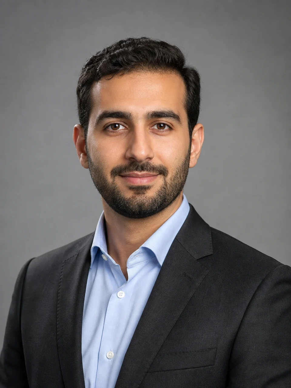 Middle East job application photo example: man in corporate attire, professional headshot, neutral background